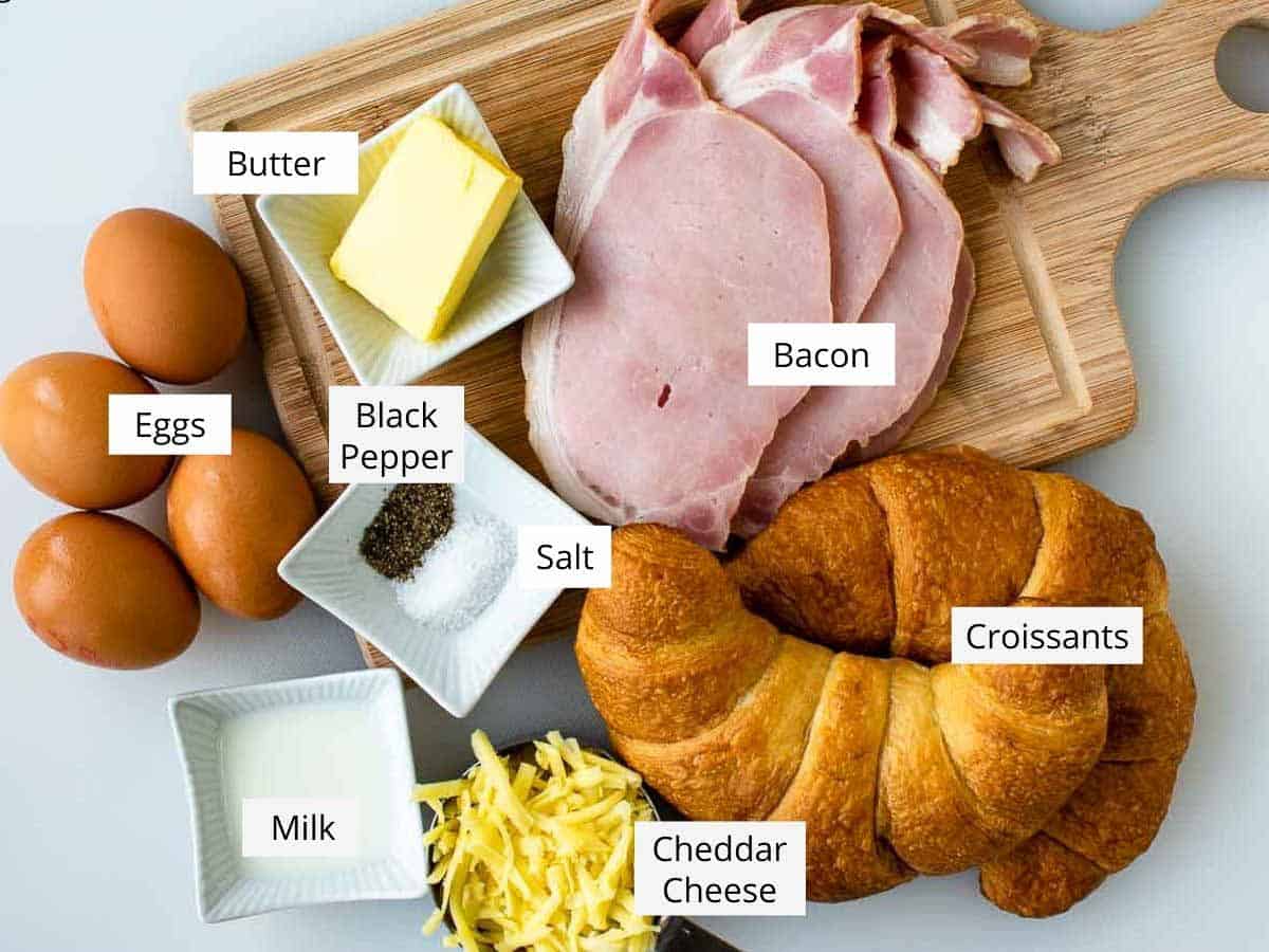 All of the ingredients required to make this recipe prepared on a wooden board. 
