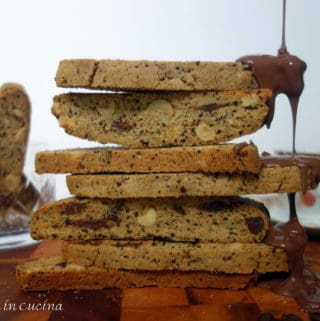 coffee biscotti stacked with chocolate dripping down one side.