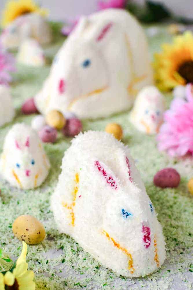 Marshmallow Easter bunnies on green coconut grass.