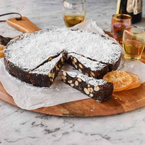 round cake of panforte with a few slices cut