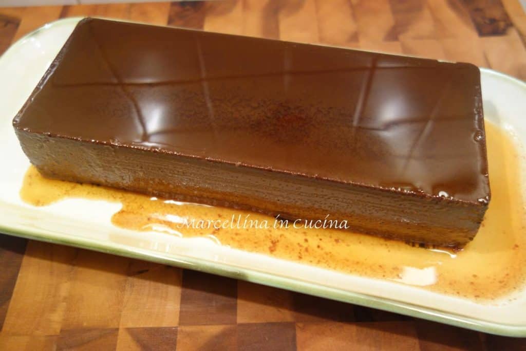 rectangular shaped chocolate pudding  on white serving tray.