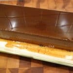 rectangular shaped chocolate pudding on white serving tray.