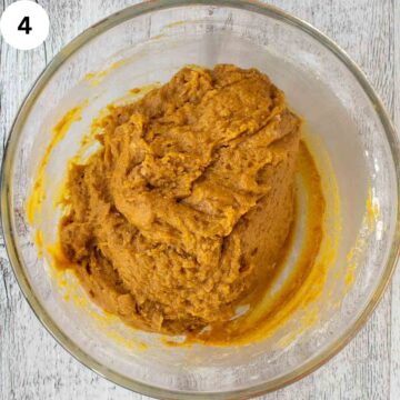 Orange brown dough in a bowl.