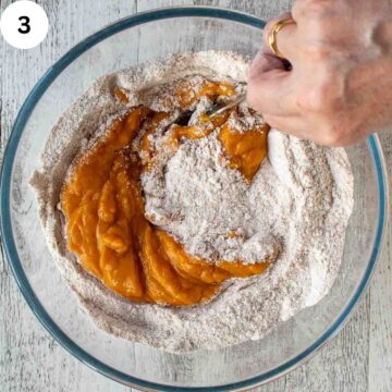 Flour mixture and pumpkin puree mixture being combined.