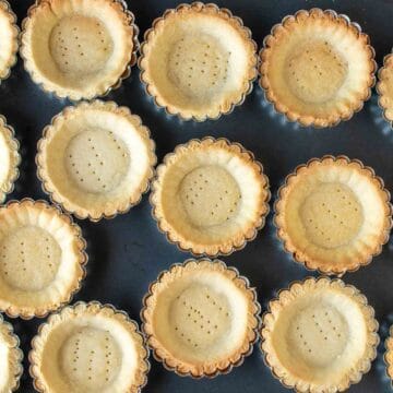 Overhead view of baked tartlet bases.