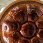 Portuguese Sweet Bread viewed from above on a wooden cake stand.