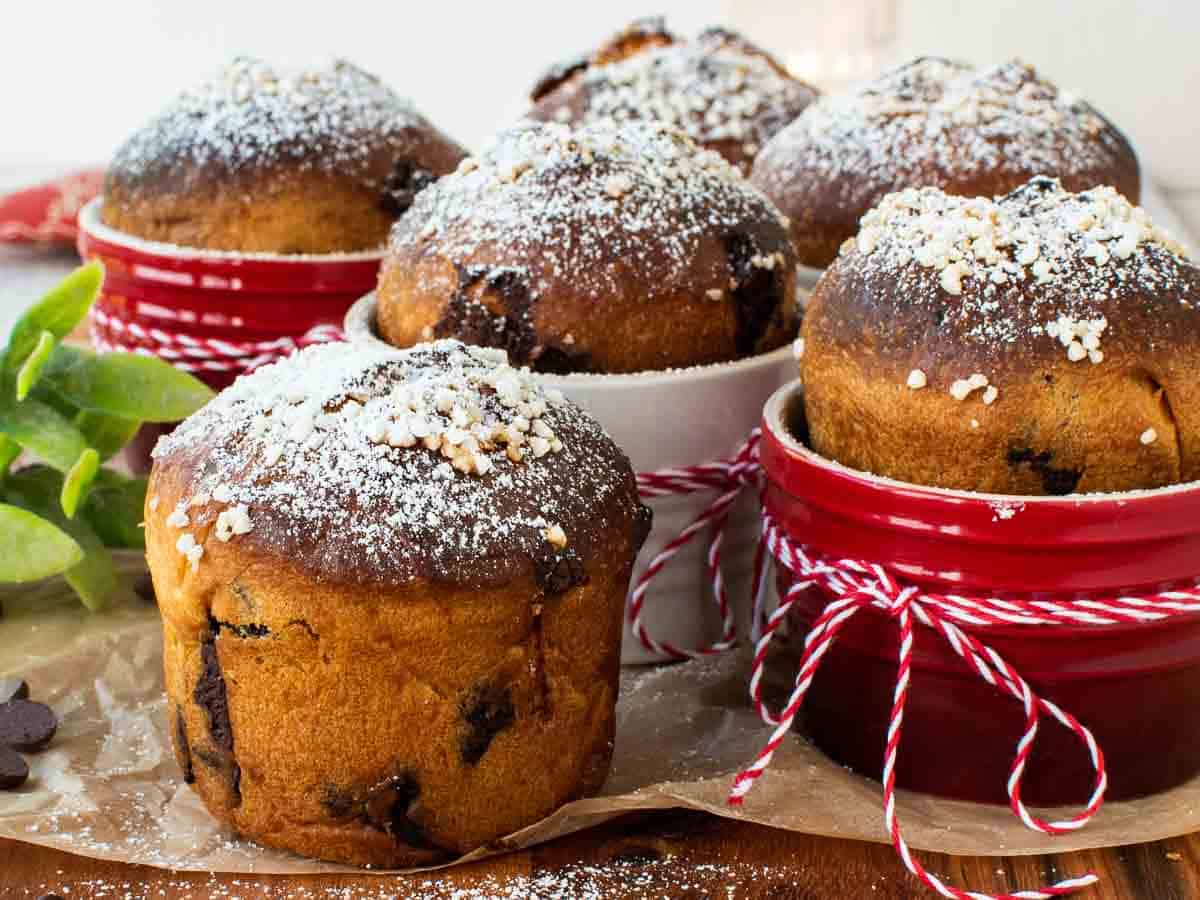 Small golden brown breads dusted with powdered sugar.