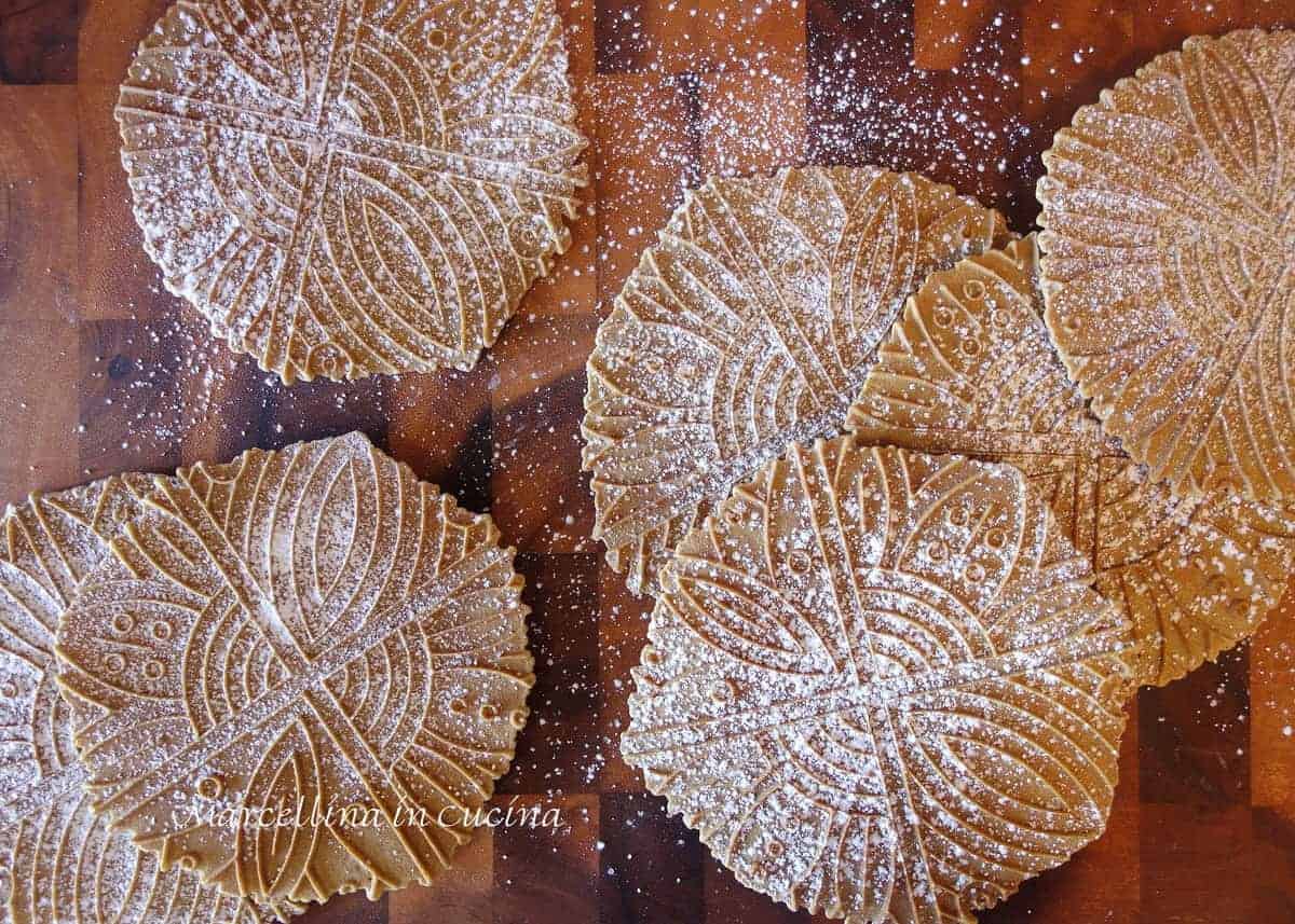 Gingerbread Pizzelle dusted with powdered sugar