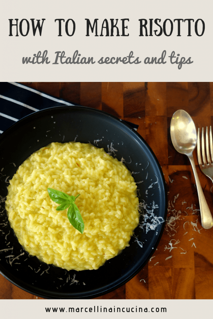 Yellow risotto on black plate