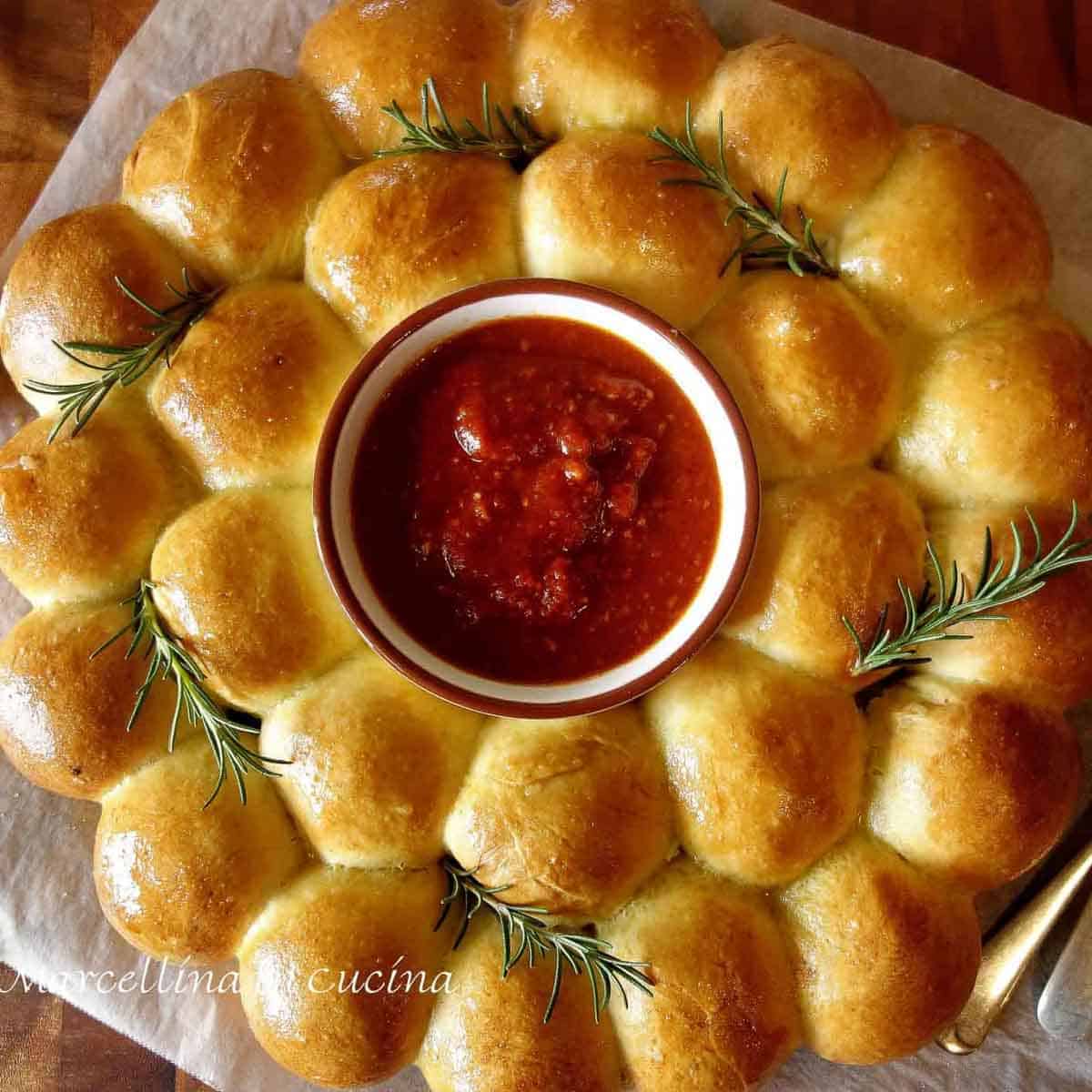 Christmas Bread Wreath filled with Cheese and Pesto