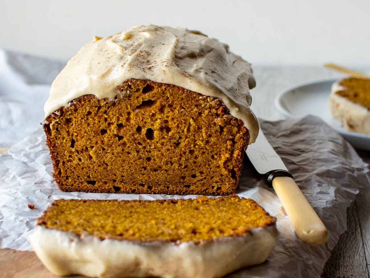 Cross section of loaf cake with frosting.