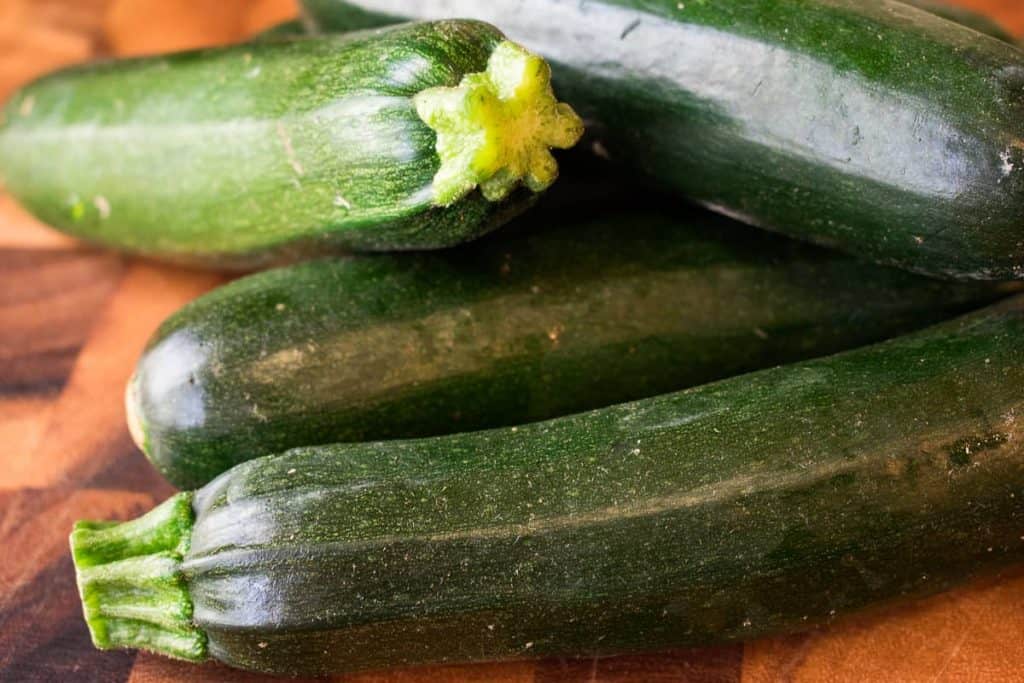 Four green zucchini