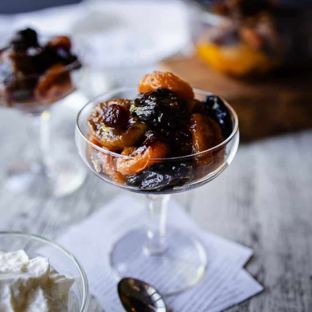 Dried Fruit Compote in a coupe glass.