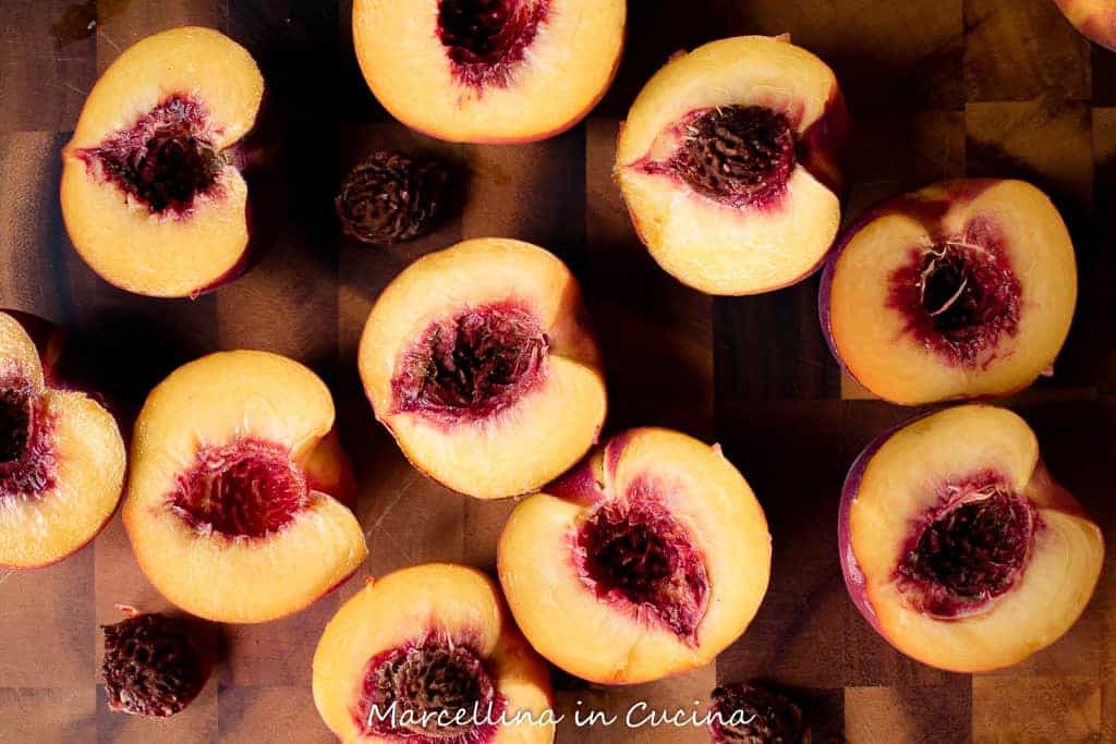 Fresh peaches cut in half.