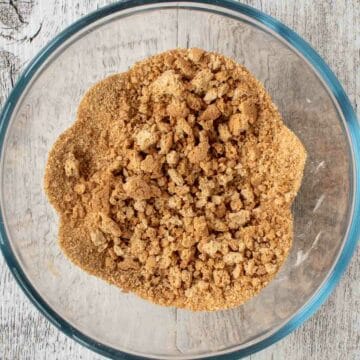 Overhead view of crumbled amaretti cookies.