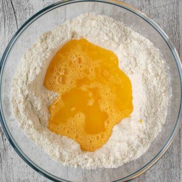 Beaten eggs and melted butter in a well of dry ingredients.