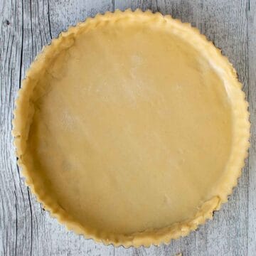 Pastry lined tart pan viewed from above.