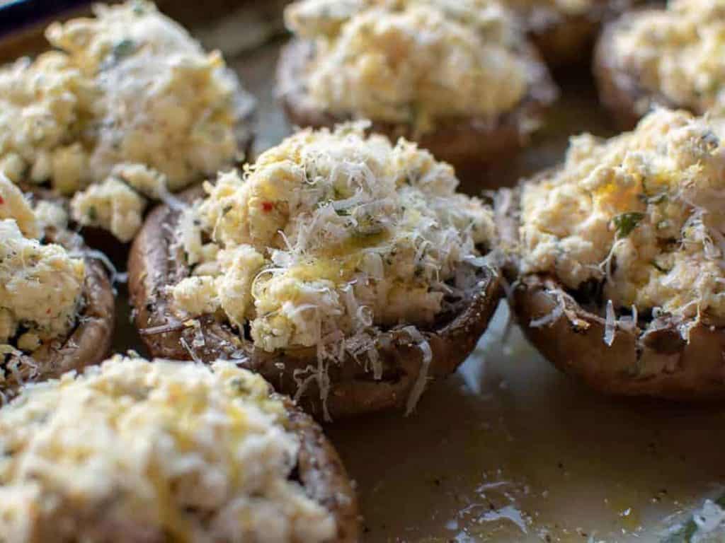 close up of mushrooms filled with ricotta.