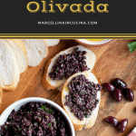 Bowl of Olivada with bread on wooden board