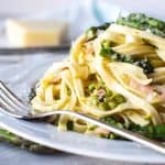 Bacon Asparagus Pasta on white plate with fork