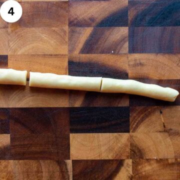 A thin log of dough cut into three pieces.