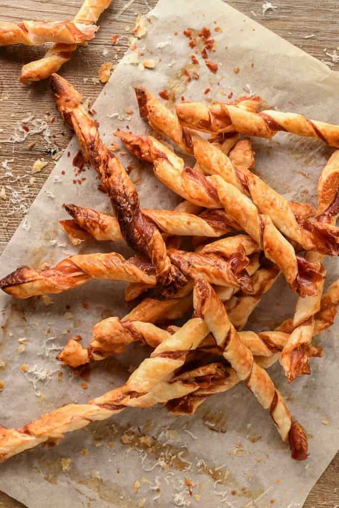 pile of puff pastry twists with prosciutto and parmesan.