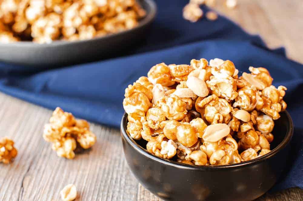 Finished caramel popcorn recipe served in bowls.