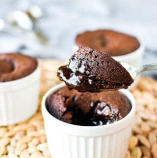 Close up of a spoonful of gooey baked chocolate pudding