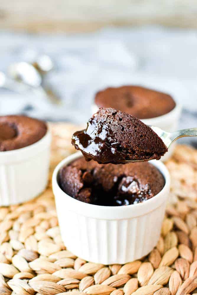 Close up of a spoonful of gooey baked chocolate pudding