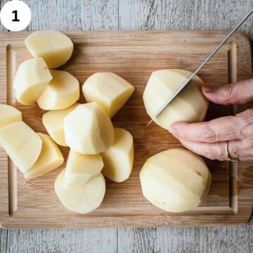 Cutting peeled potatoes on a wooden cutting board.