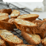 Almond biscotti on black wire rack