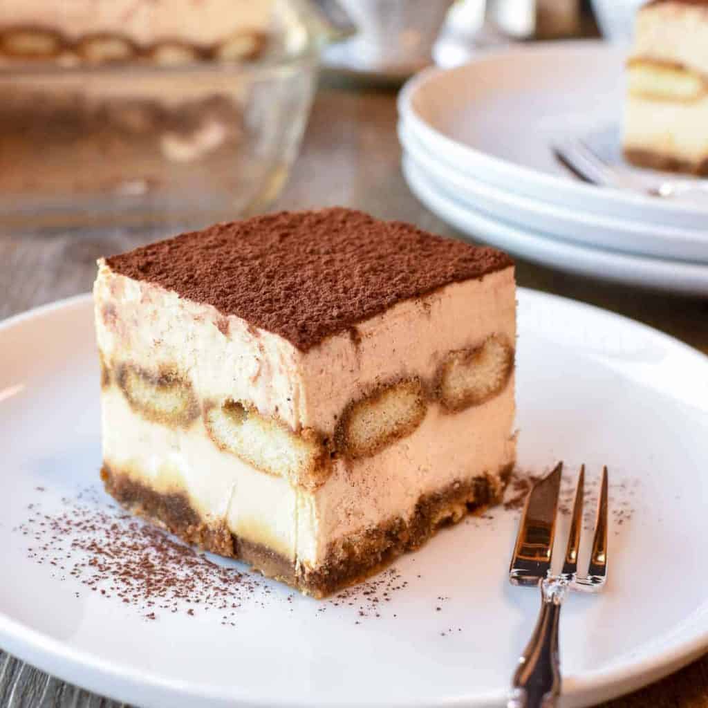 square slice of tiramisu on white plate