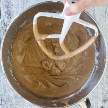 Brown creamy batter in stainless steel bowl.