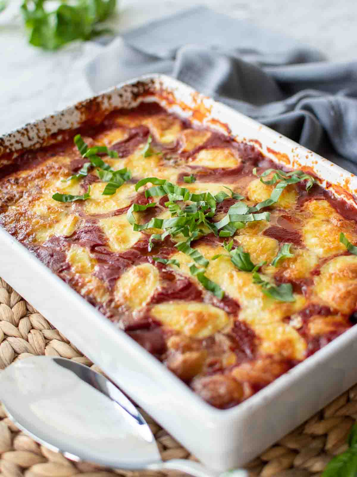 Eggplant involtini in baked with tomato sauce and cheese topping.
