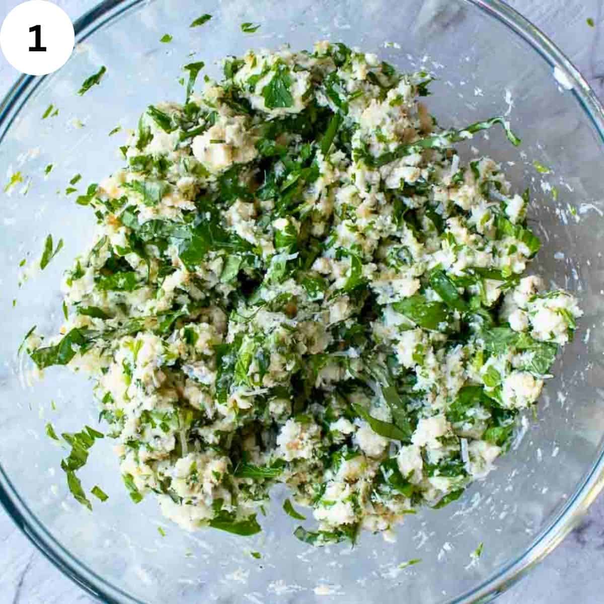 Ricotta cheese and herb filling in a bowl.