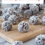 Image with text. Text reads Boozy Rum Balls Holiday Entertaining. Image is rum balls on wooden board