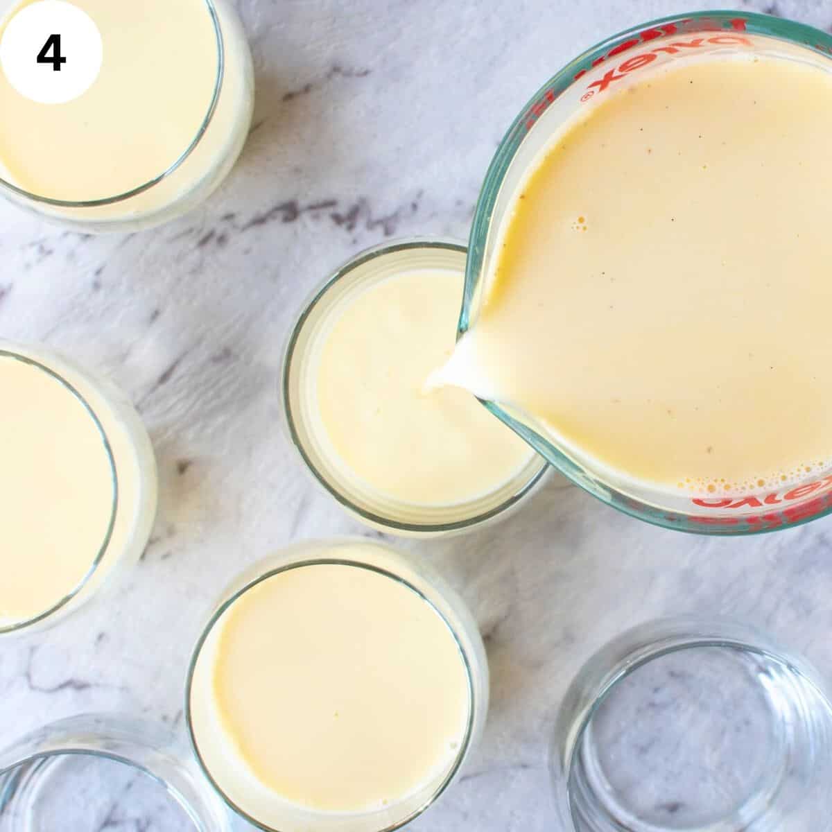 Pouring cream from a glass pitcher into serving glasses.