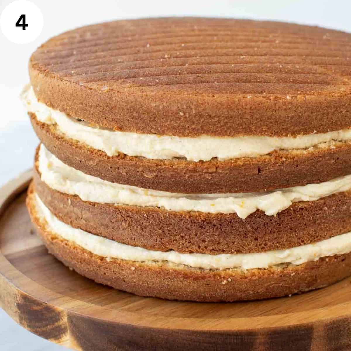 Side view of four cake layers with cream filling.