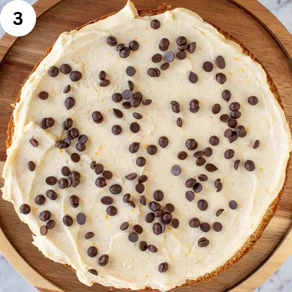 Chocolate chips on frosting.