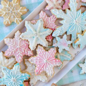 pink, white and blue decorated sugar cookies viewed from above.