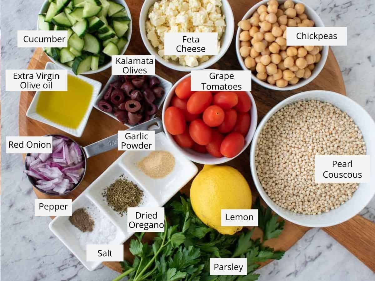 Labelled ingredients to make the recipe prepared on a wooden serving board