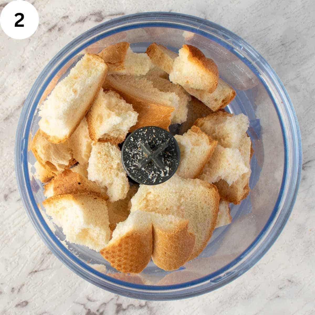 Chunks of bread in a food processor.