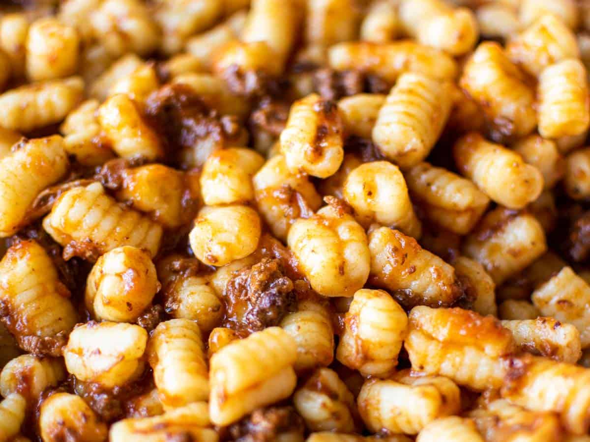 close up of pasta with bolognese sauce.