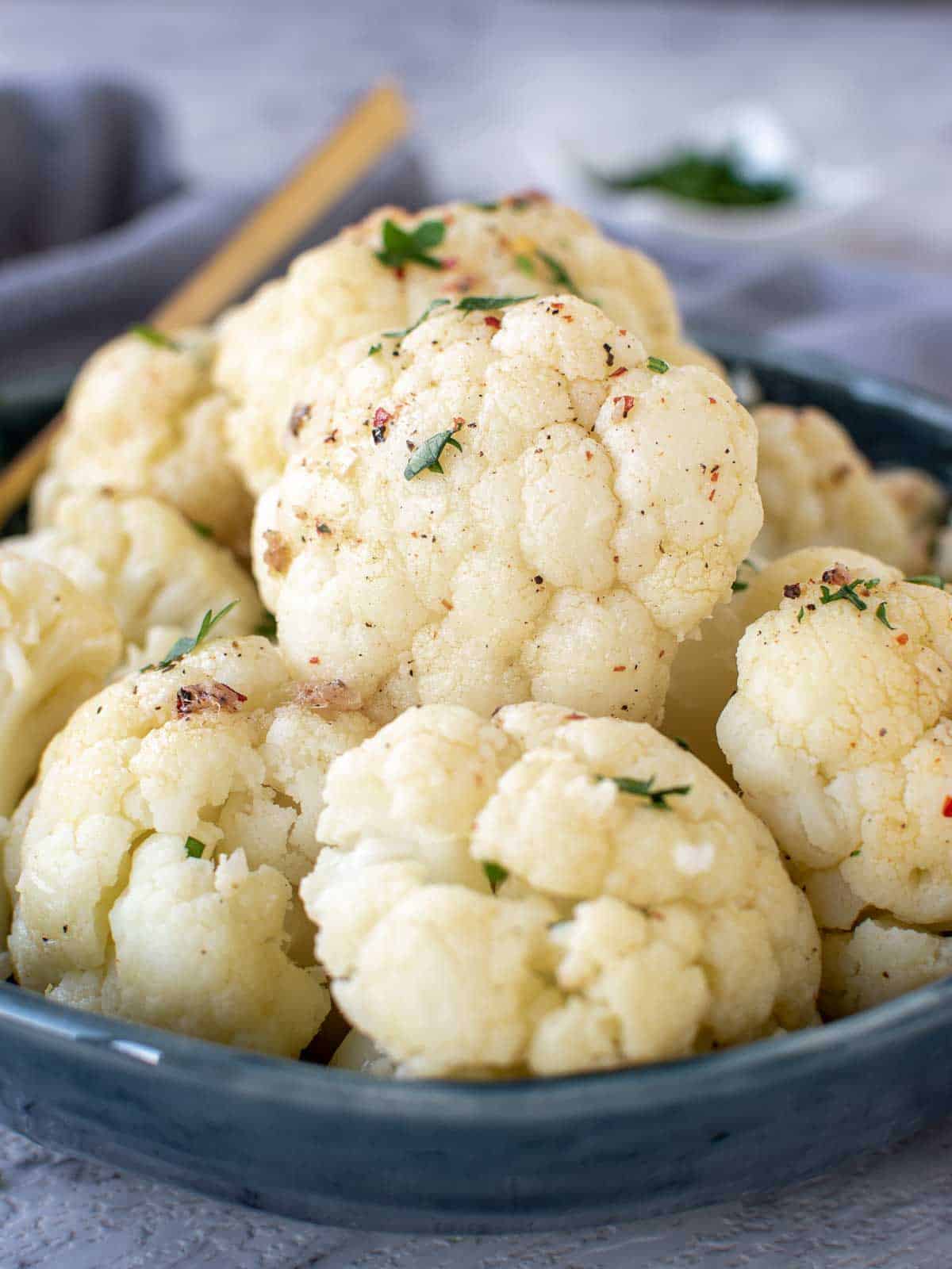 Close up of Instant pot cauliflower in a blue bowl.