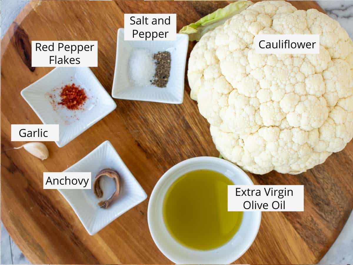 Labelled ingredients laid out on a wooden table.