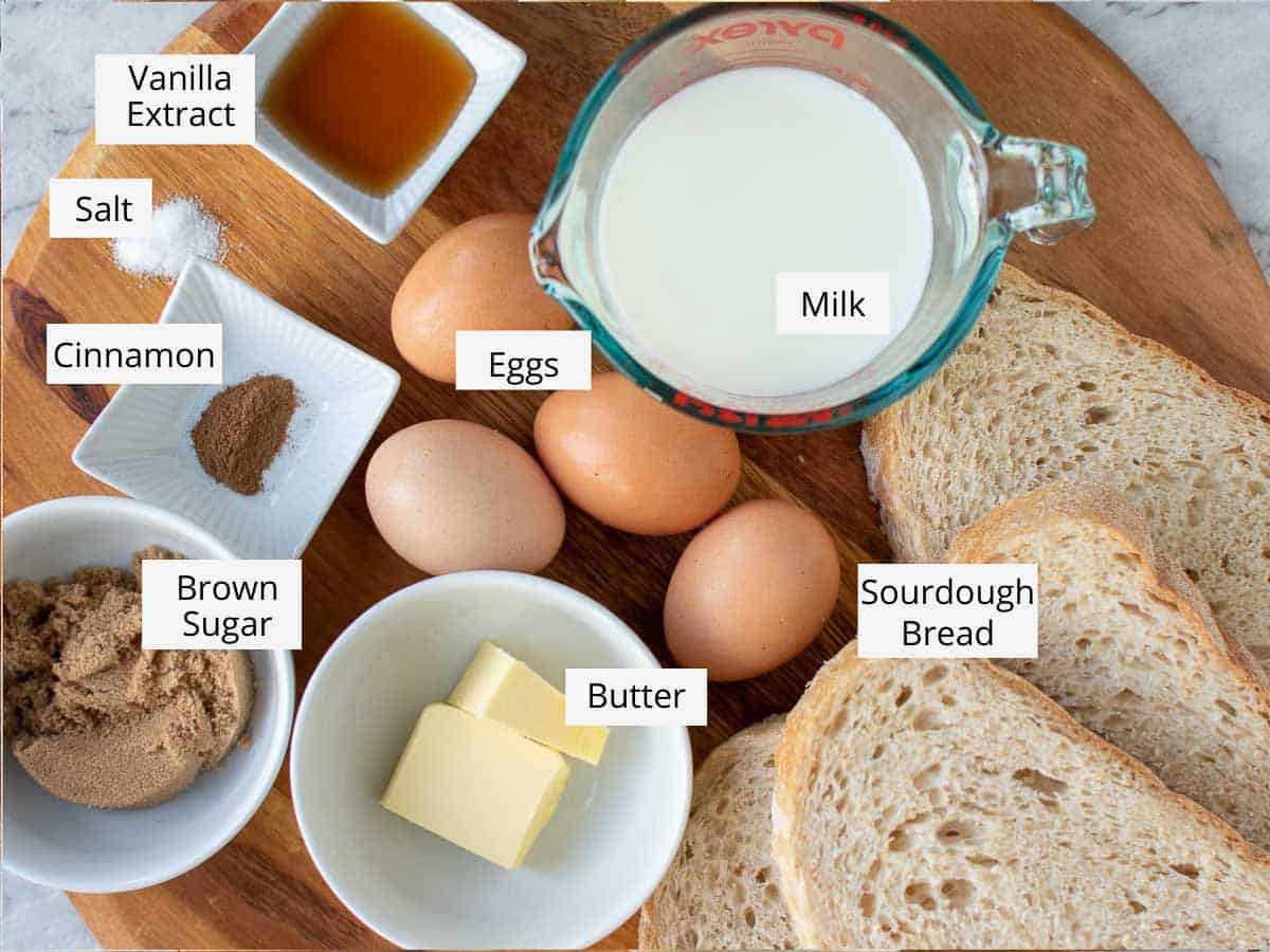 All the ingredients to make the recipe prepared on a wooden cutting board. 