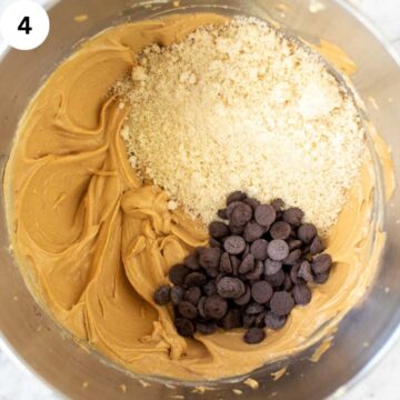 Chocolate chips and almond flour on top of a creamy mixture.