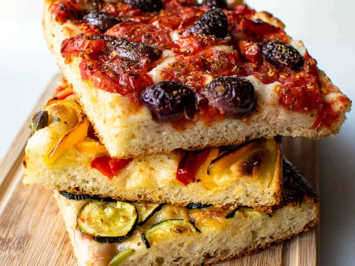 three squares of focaccia bread stacked.