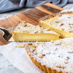 pie with pastry cream filling with a slice cut and pulled out.