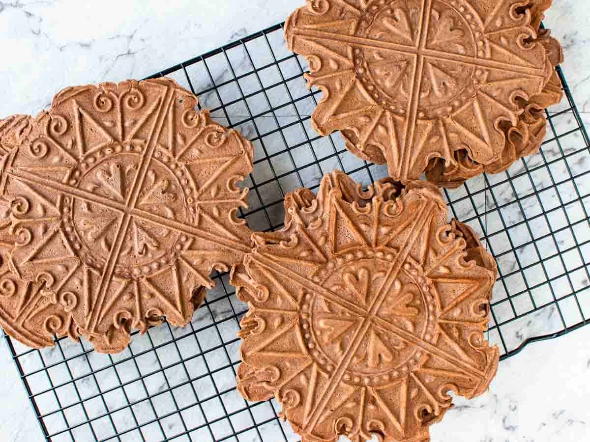 chocolate patterned cookies on a black wire rack.